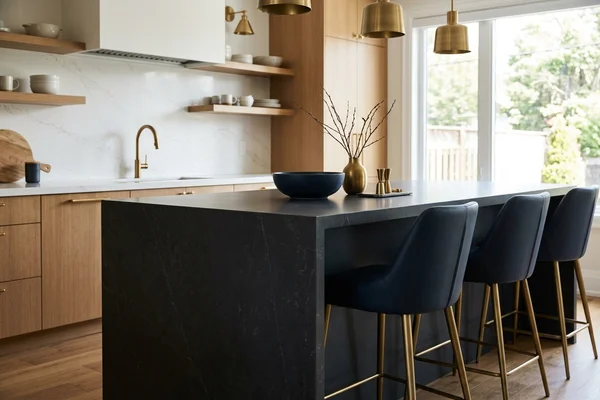 Dark Dekton sintered stone island with a mitred waterfall leg